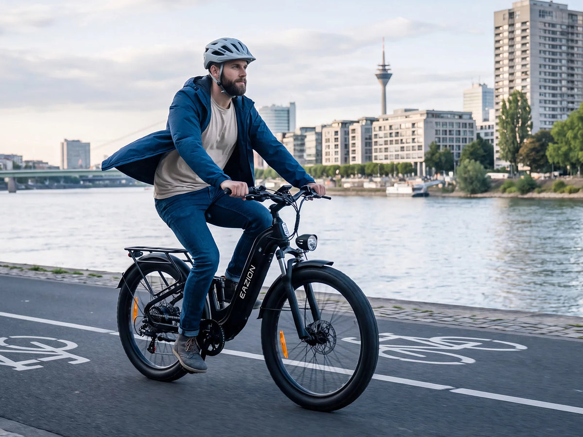 Adult rider commuting along the city riverfront on Eazion N9 Pro fat tire electric bike for adults