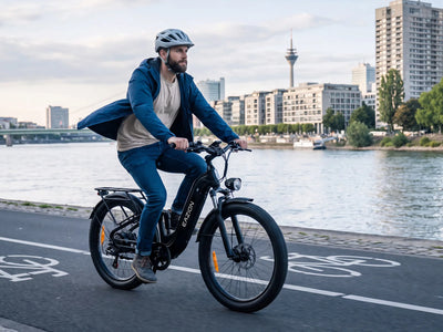 Adult rider commuting along the city riverfront on Eazion N9 Pro fat tire electric bike for adults